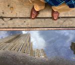 reflet flaque « Je travaille en face de l'Empire State Building »