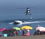 helicoptere Un narcotrafiquant débarque en bateau sur une plage